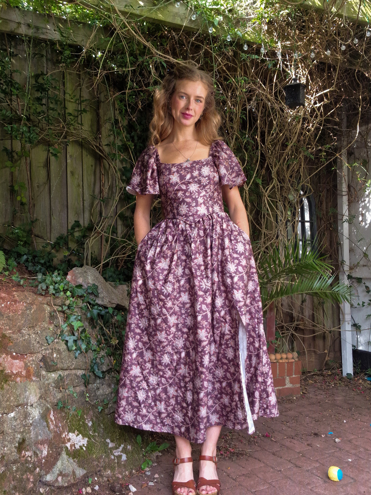 10" butterfly sleeves, pointed waistband, skirt with slit 