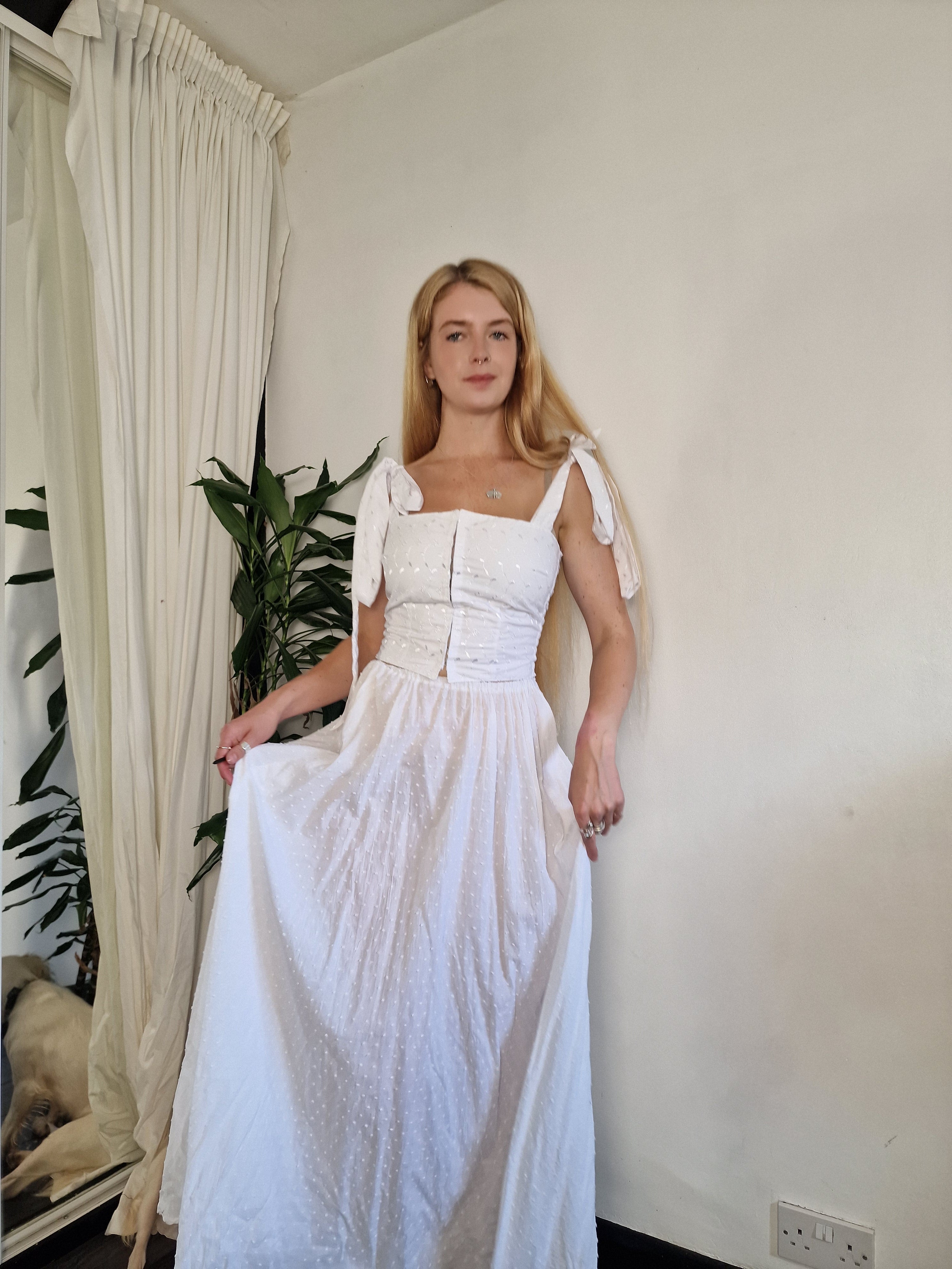 White Dobby spot skirt, recommend adding a petticoat as it's sheer (sample UK 6/8)